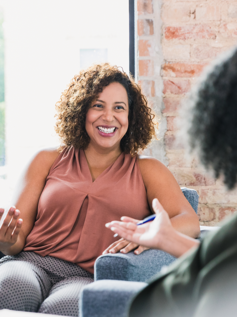 a woman happy with her therapy service